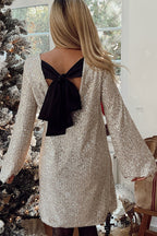 Robe mini ample à sequins et nœud papillon dans le dos, inspirée par Lost in Your Eyes 
