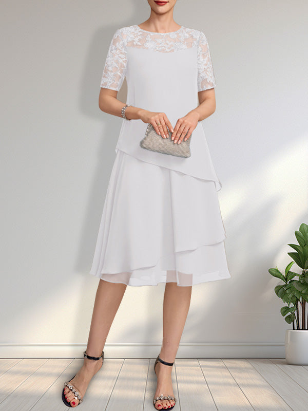 Vestido de novia de corte línea A con escote ilusión, largo hasta la rodilla, de encaje y gasa con lentejuelas.
