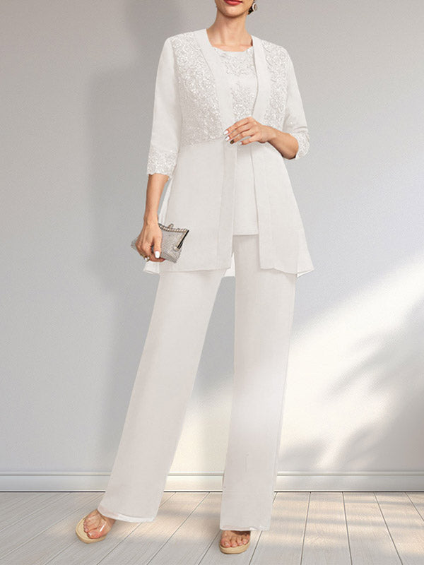 Vestido de novia de gasa con encaje y lentejuelas, estilo mono/traje pantalón, largo hasta el suelo, con escote redondo.