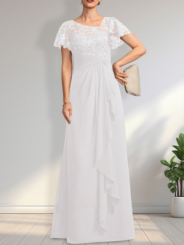Vestido de novia de corte asimétrico, ilusión, largo hasta el suelo, de encaje y gasa, con cascada de volantes y lentejuelas. 