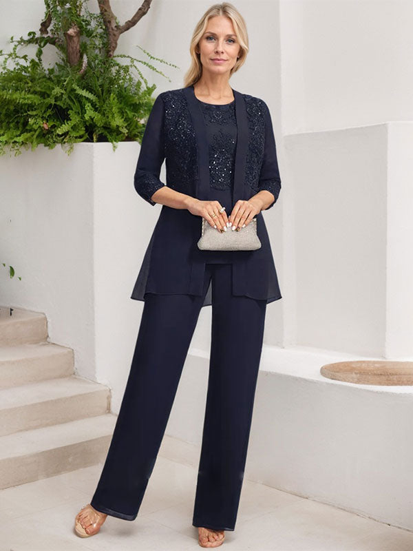 Vestido de novia de gasa con encaje y lentejuelas, estilo mono/traje pantalón, largo hasta el suelo, con escote redondo.