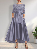 Vestido de madrina de la novia, corte asimétrico, escote ilusión, satén y encaje, con lazo.