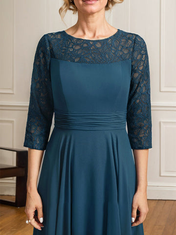 Vestido de novia de corte A, escote redondo ilusión, largo hasta el suelo, de gasa de encaje con pliegues. 