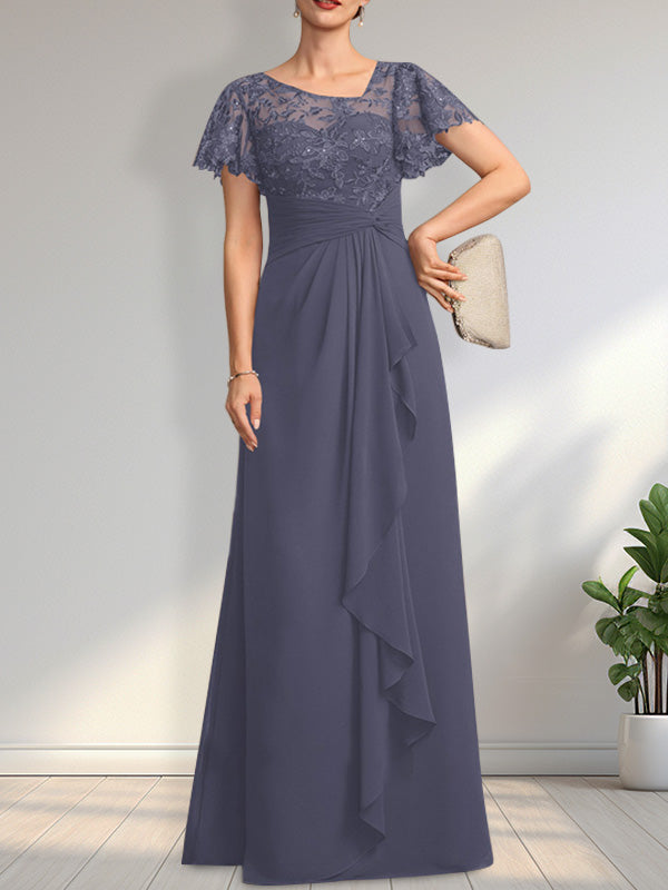 Vestido de novia de corte asimétrico, ilusión, largo hasta el suelo, de encaje y gasa, con cascada de volantes y lentejuelas. 