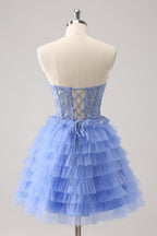 Robe de bal bustier trapèze en tulle à volants et corset à appliques