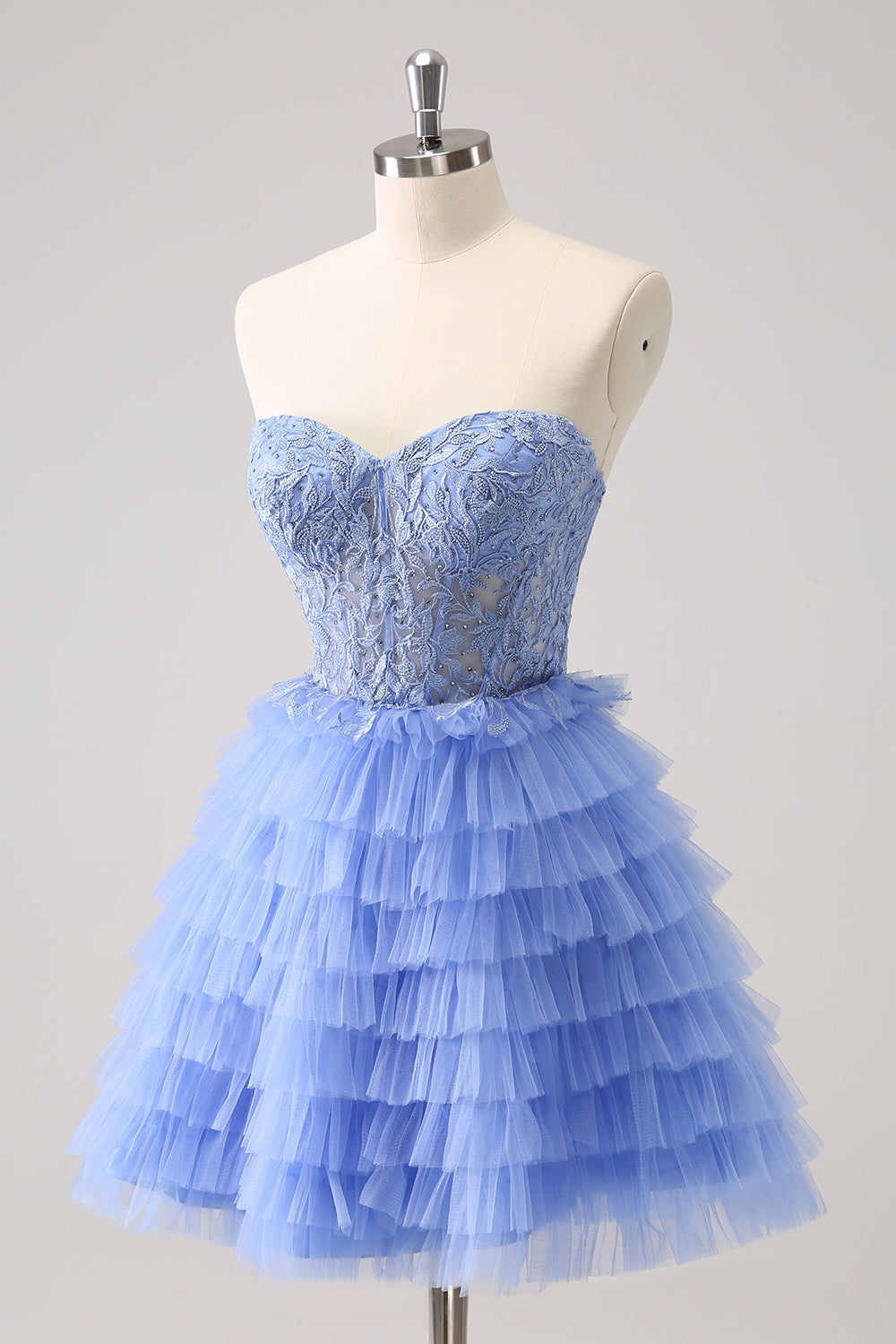 Robe de bal bustier trapèze en tulle à volants et corset à appliques