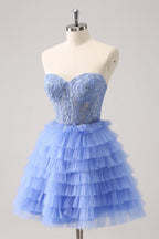Robe de bal bustier trapèze en tulle à volants et corset à appliques