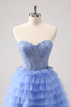 Robe de bal bustier trapèze en tulle à volants et corset à appliques