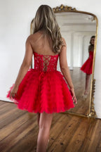 Robe de bal bustier en tulle à volants et décolleté en A, ornée d'appliques