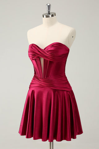 Vestido de fiesta fucsia de moda con escote corazón, corte en A y corsé de satén.