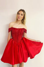 Vestido de fiesta de satén corte A con corsé y hombros descubiertos, adornado con cuentas.