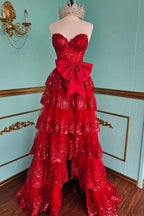 Robe de bal longue à corset à volants et décolleté en A, ornée de sequins et d'un nœud, avec décolleté en cœur et paillettes.