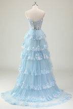 Robe de bal longue à sequins scintillants, coupe trapèze, bustier à volants et fente.