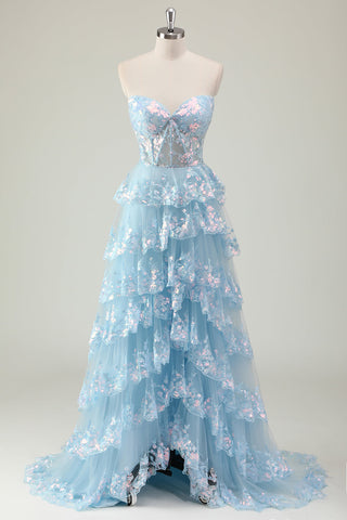 Robe de bal longue à corset en tulle à sequins scintillants, coupe trapèze, décolleté cœur et fente. Coupe trapèze, décolleté cœur, bustier à volants et sequins. Fente.
