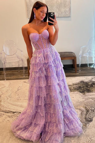 Robe de bal longue en tulle violet pailleté, décolleté cœur, bustier à volants et corset à volants