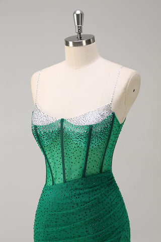 Vestido de fiesta largo de sirena con corsé, tirantes finos, lentejuelas y abertura, color azul real brillante.