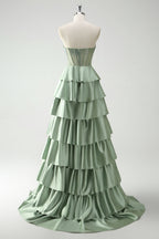 Robe de bal longue vert pailleté coupe trapèze à corset à volants