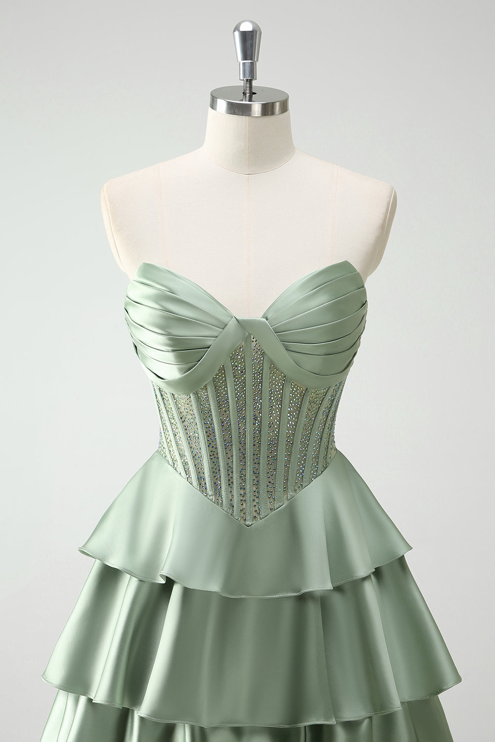 Robe de bal longue vert pailleté coupe trapèze à corset à volants
