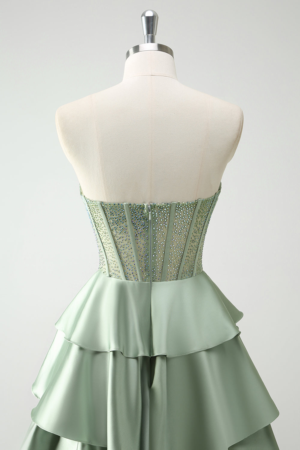 Robe de bal longue vert pailleté coupe trapèze à corset à volants