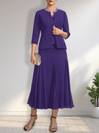 Vestido de novia de gasa, corte línea A, escote redondo, largo té, con lentejuelas y pedrería. 