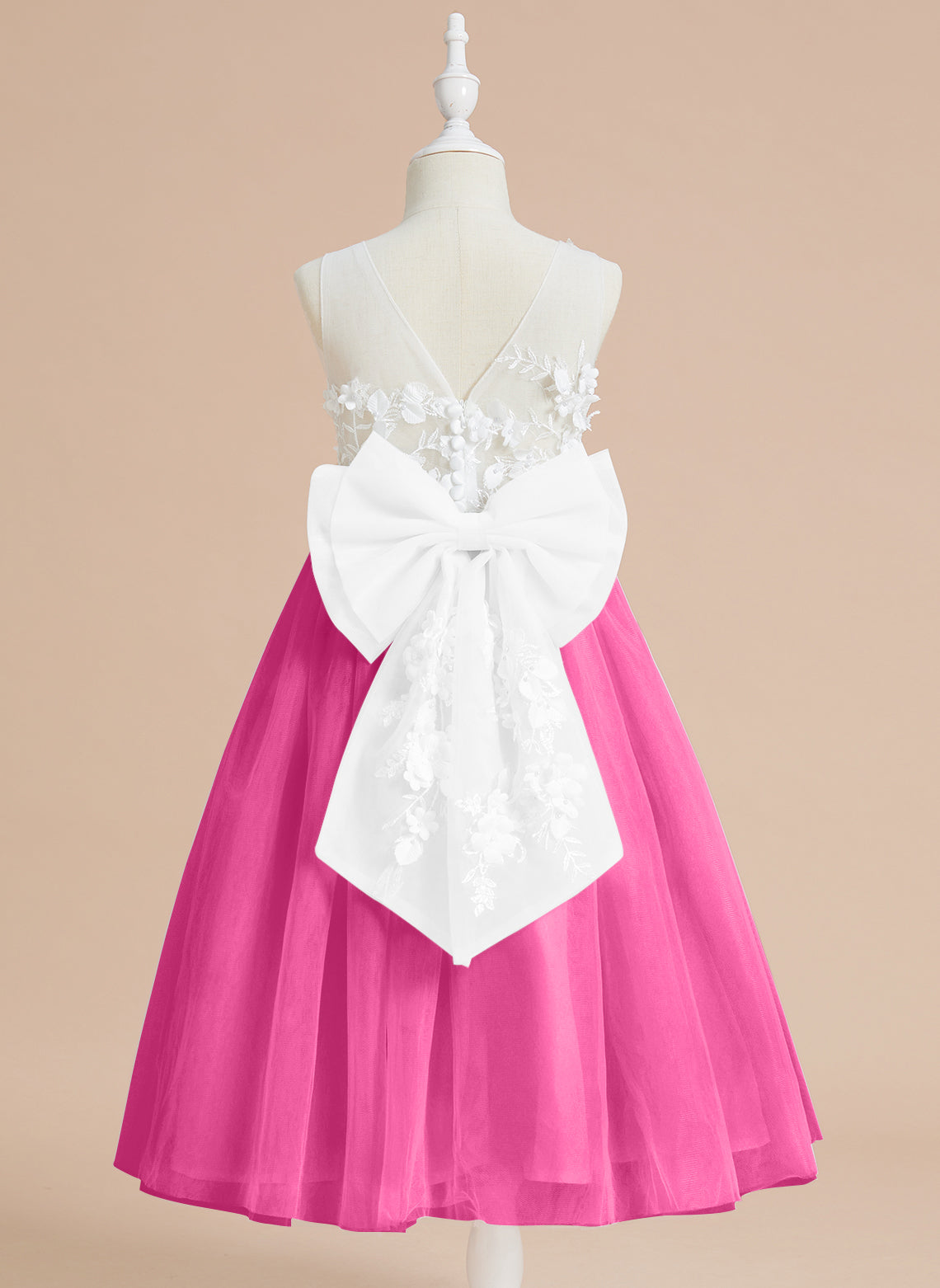 Vestido midi de encaje floral y lazo grande 