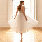 Robe de mariée romantique bustier sans manches, coupe trapèze, dos nu court, robe de soirée élégante en tulle avec nœud. 
