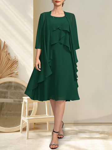 Vestido de gasa corte A con escote redondo y largo hasta la rodilla para la madre de la novia, con pedrería.