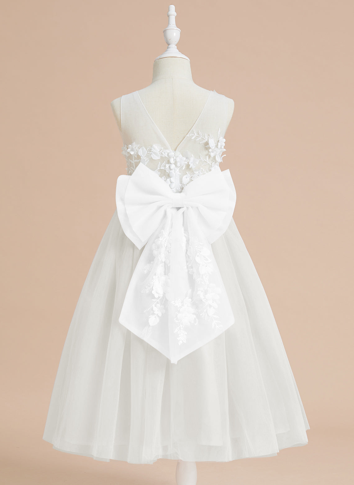 Vestido midi de encaje floral y lazo grande 