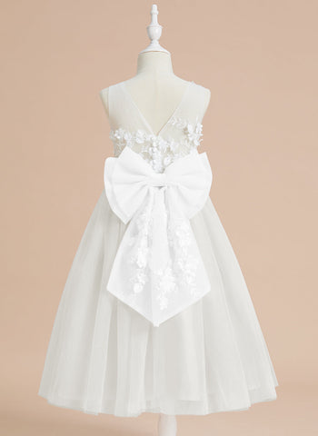 Vestido midi de encaje floral y lazo grande 