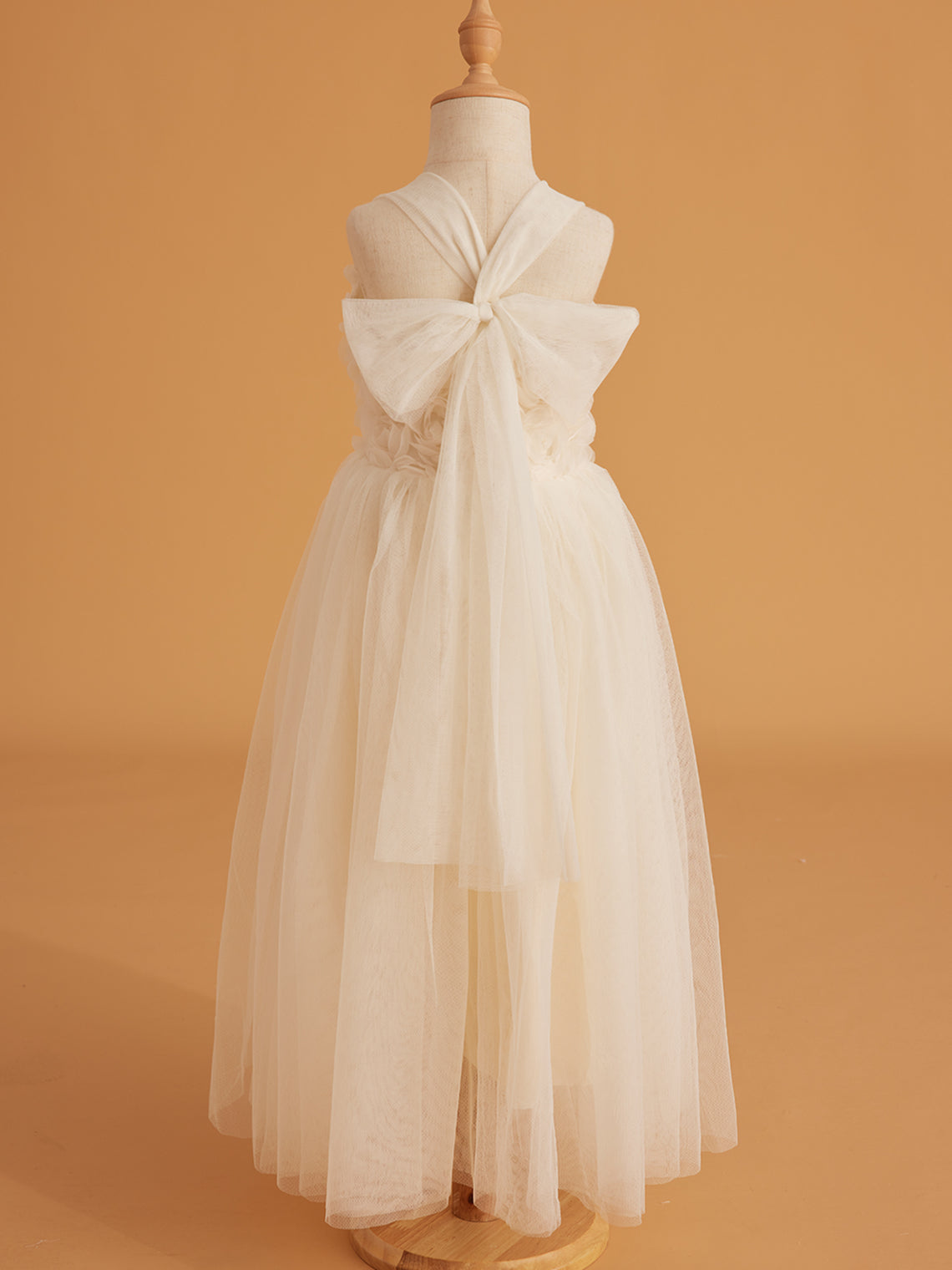 Vestido de bebé niña con lazo de tul y aplique floral en 3D de la colección Jardín Encantado 