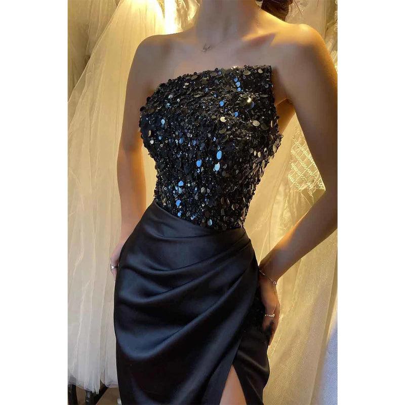 Robe de soirée longue noire sans bretelles avec haut à paillettes et fente 