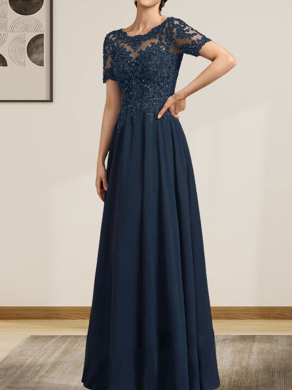 Vestido de corte A, escote ilusión, largo hasta el suelo, de gasa y encaje, con lentejuelas y pedrería, para la madre de la novia.