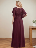 Vestido de novia de corte A, escote redondo, ilusión, largo hasta el suelo, de encaje y gasa con lentejuelas. 