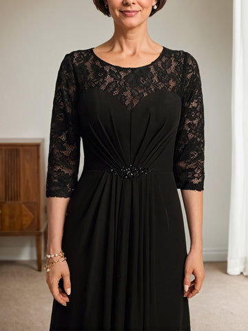 Vestido de novia de corte línea A, escote redondo ilusión, largo hasta el suelo, de gasa de encaje con volantes y pedrería. 