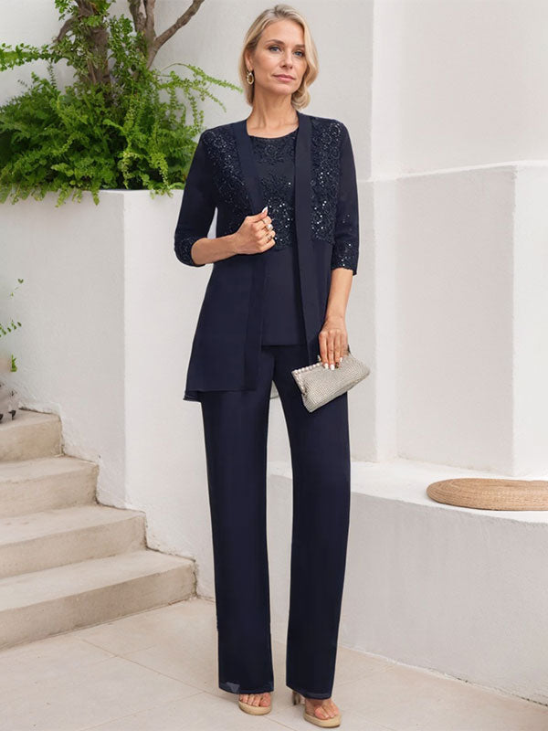 Vestido de novia de gasa con encaje y lentejuelas, estilo mono/traje pantalón, largo hasta el suelo, con escote redondo.