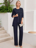 Vestido de novia de gasa con encaje y lentejuelas, estilo mono/traje pantalón, largo hasta el suelo, con escote redondo.