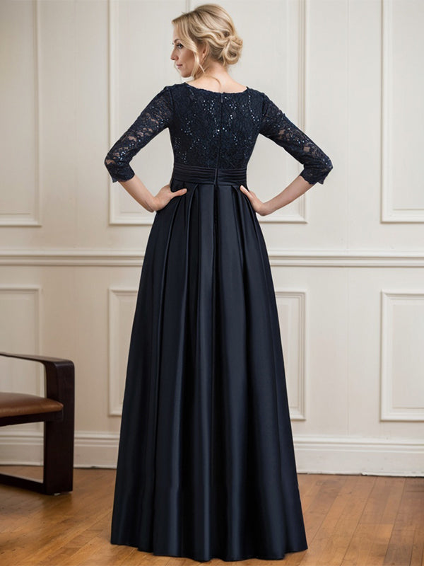 Vestido de novia de satén con encaje, corte en A, escote en V y largo hasta el suelo, con lazo de lentejuelas. 