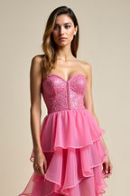 Robe de bal longue corail à décolleté en A et volants