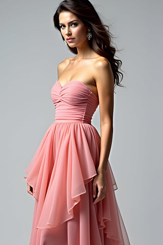 Robe de bal longue bustier froncée rose poudré à volants