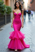 Robe de bal longue fuchsia bustier en satin à volants