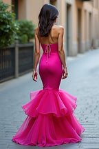 Robe de bal longue fuchsia bustier en satin à volants