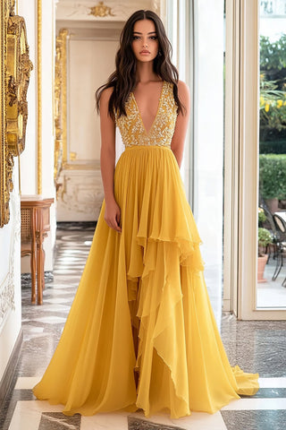 Vestido largo de fiesta amarillo con escote en V profundo y corte en A con apliques