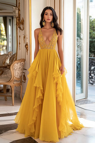 Vestido largo de fiesta amarillo con escote en V profundo, fruncido y con volantes