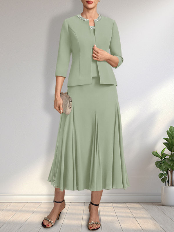 Vestido de novia de gasa, corte línea A, escote redondo, largo té, con lentejuelas y pedrería. 
