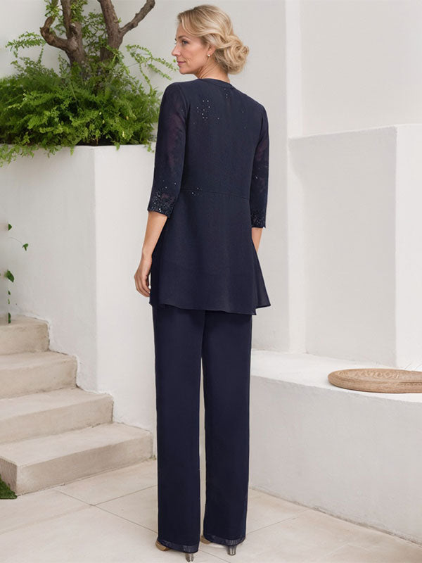 Vestido de novia de gasa con encaje y lentejuelas, estilo mono/traje pantalón, largo hasta el suelo, con escote redondo.