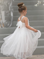 Vestido de bebé niña con lazo de tul y aplique floral en 3D de la colección Jardín Encantado 