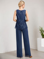 Vestido de novia de gasa con encaje y lentejuelas, estilo mono/pantalón, largo hasta el suelo, con escote redondo.