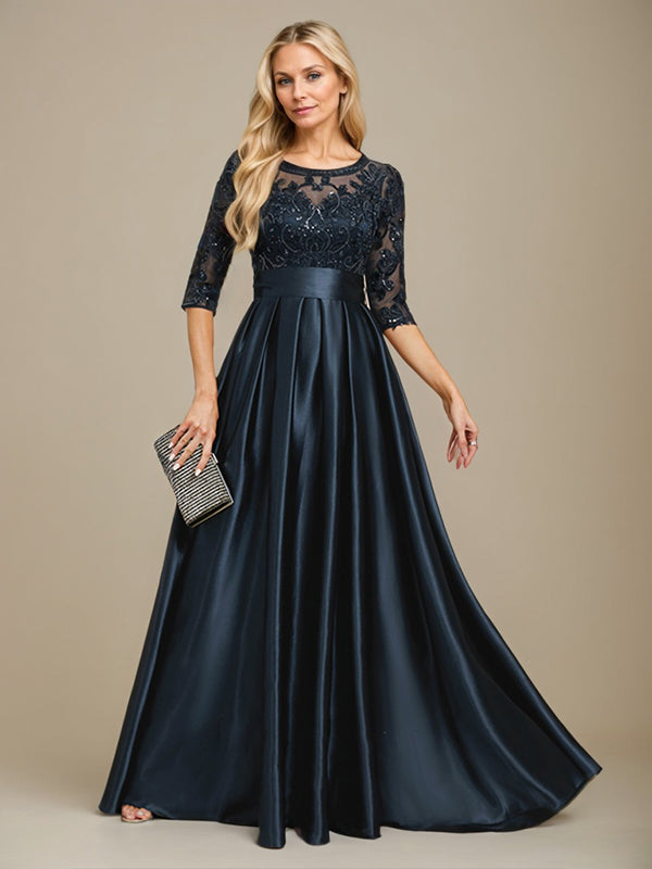 Robe de mariée longue en satin stretch dentelle et dentelle, coupe trapèze, décolleté illusion, ornée d'un nœud à sequins 