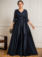 Vestido de novia de satén con encaje, corte en A, escote en V y largo hasta el suelo, con lazo de lentejuelas. 