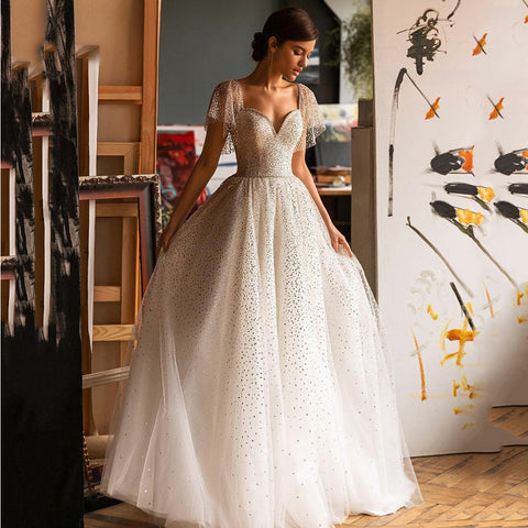 Vestidos de novia elegantes con brillo y escote corazón para mujer, corte en A, mangas tipo murciélago, espalda descubierta de tul.